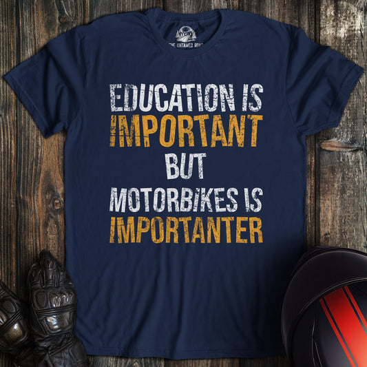 A navy colored t-shirt with the words "education is important" printed on the front.