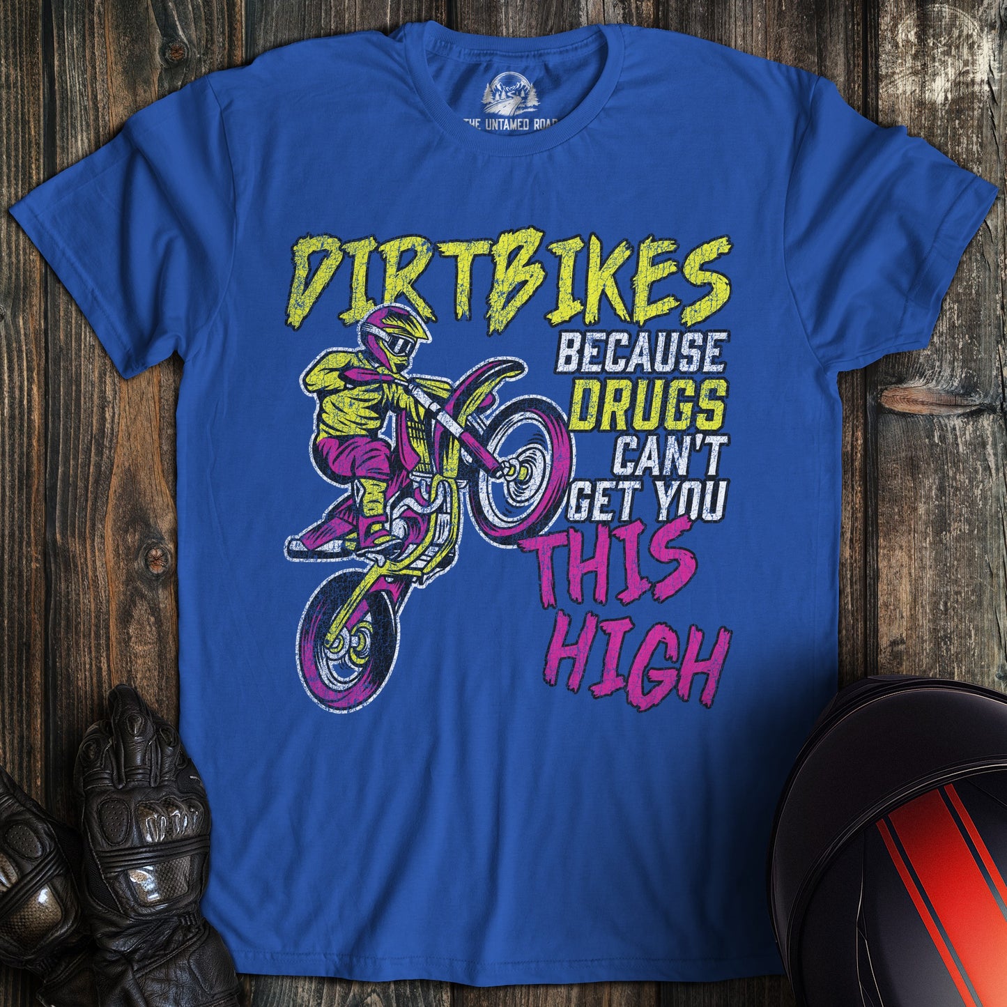 A royal blue colored t-shirt with the words "motocross drugs" printed on the front.