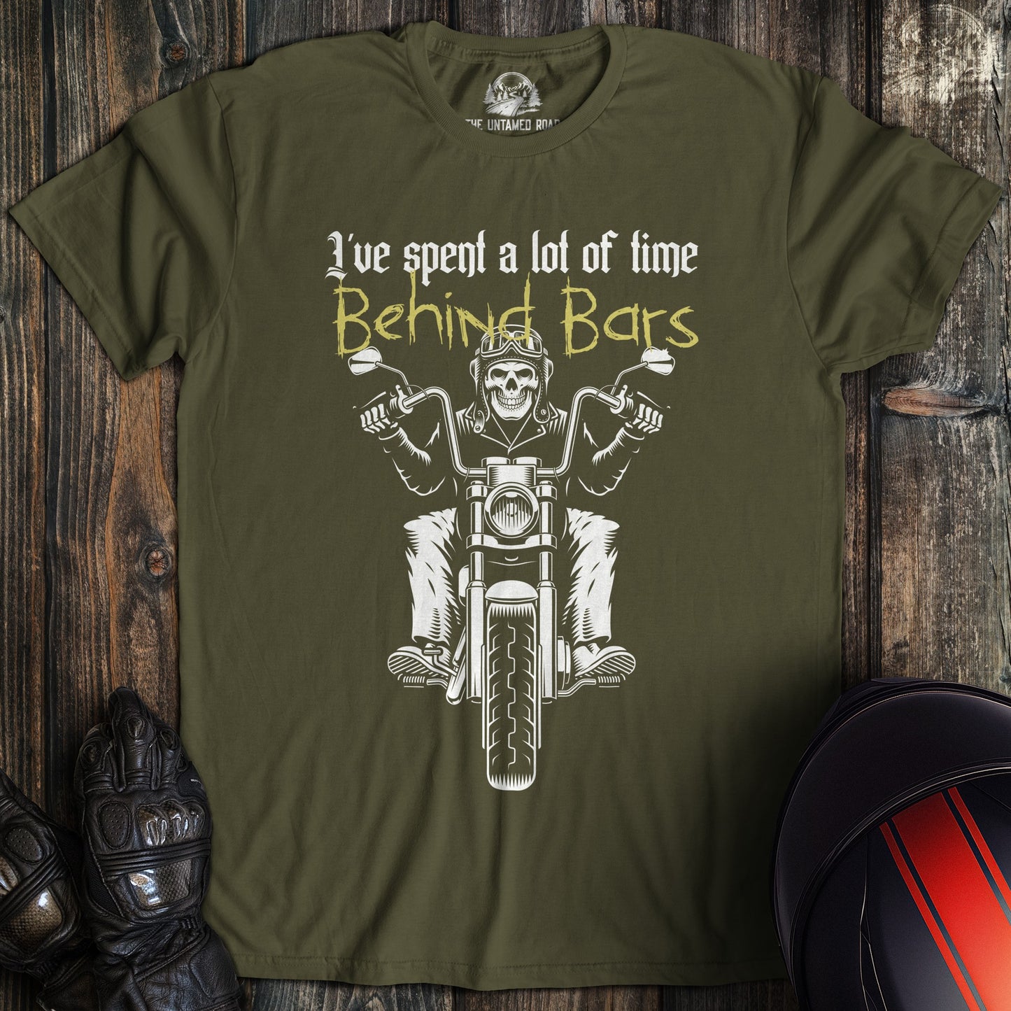 A military green colored t-shirt with the words "time behind bars" printed on the front.