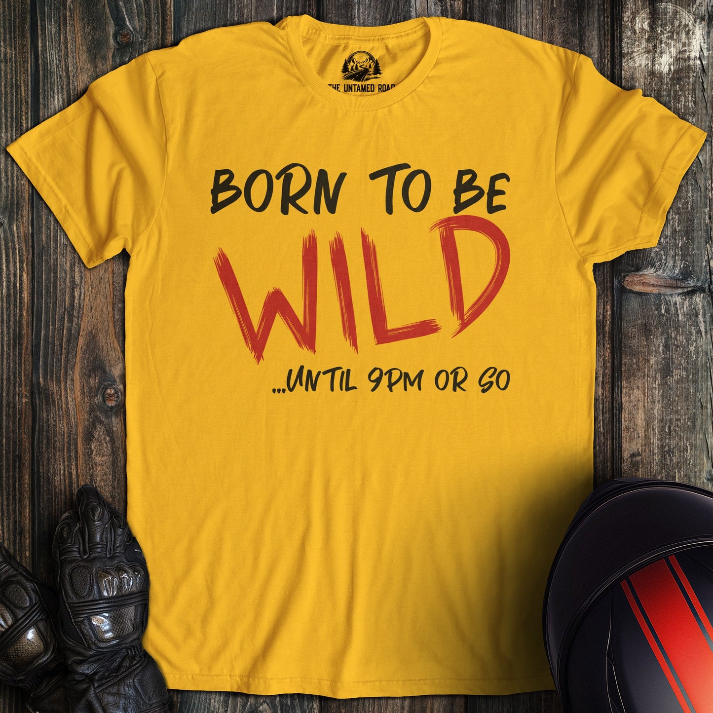 A gold colored t-shirt with the words "born to be wild" printed on the front.