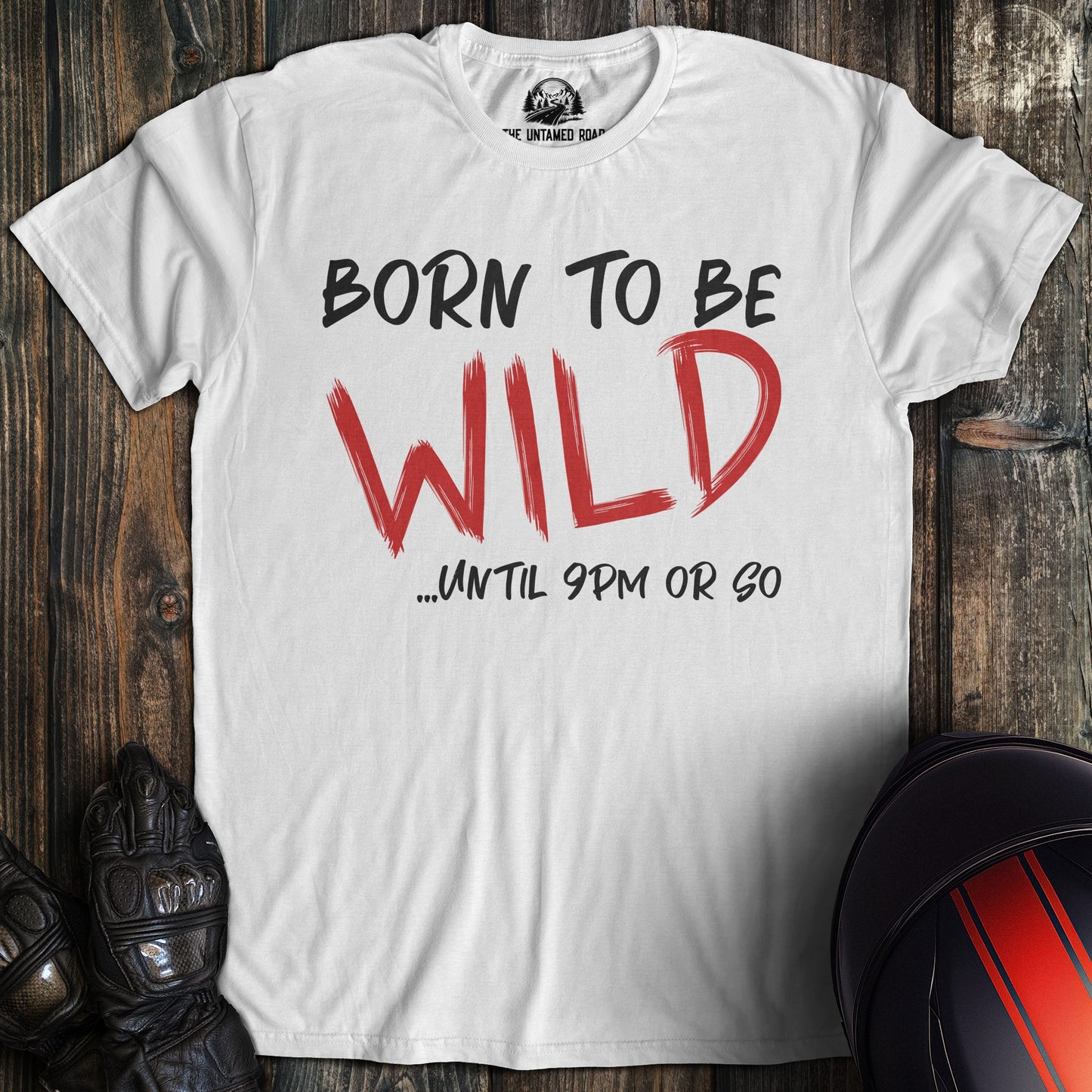 A white colored t-shirt with the words "born to be wild" printed on the front.