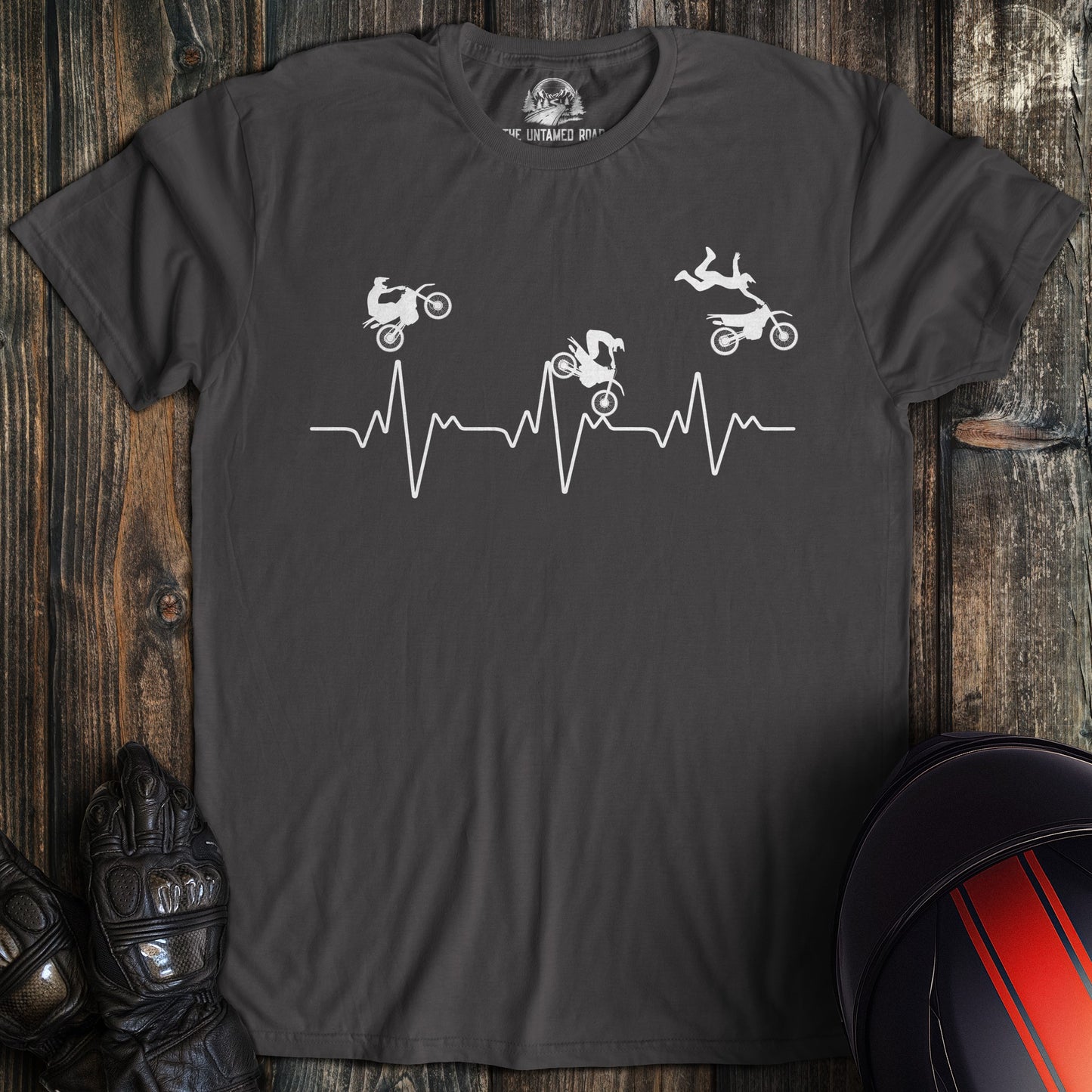 A charcoal colored t-shirt with the words "dirtbike heartbeat" printed on the front.