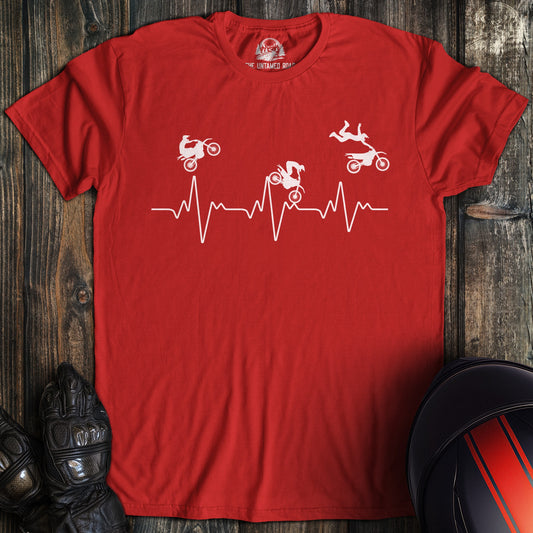 A red colored t-shirt with the words "dirtbike heartbeat" printed on the front.