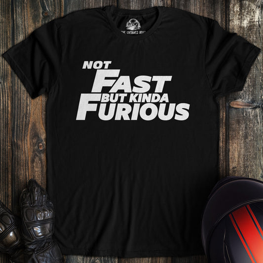 A black colored t-shirt with the words "not fast kinda furious minimal" printed on the front.
