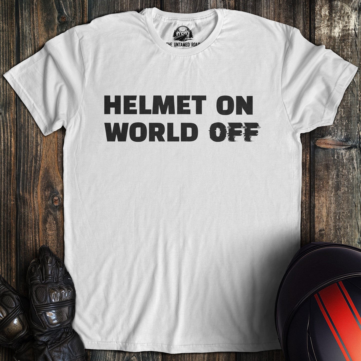 A white colored t-shirt with the words "helmet on world off" printed on the front.
