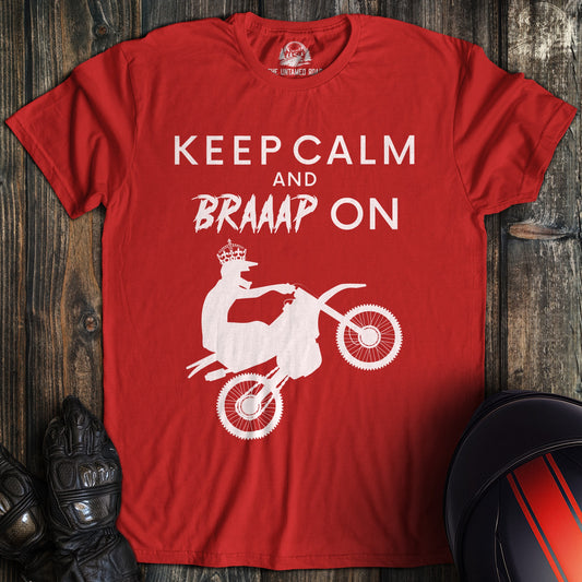 A red colored t-shirt with the words "keep calm braaap" printed on the front.