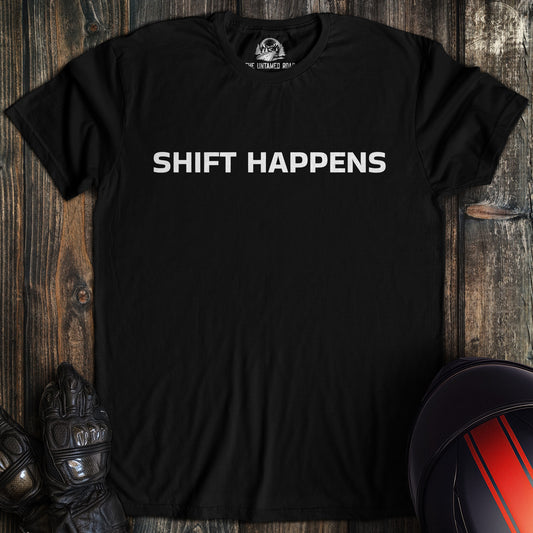 A black colored t-shirt with the words "shift happens" printed on the front.