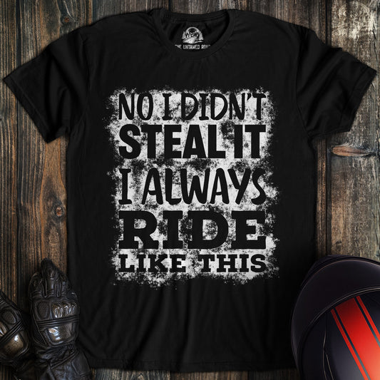 A black colored t-shirt with the words "didnt steal it" printed on the front.