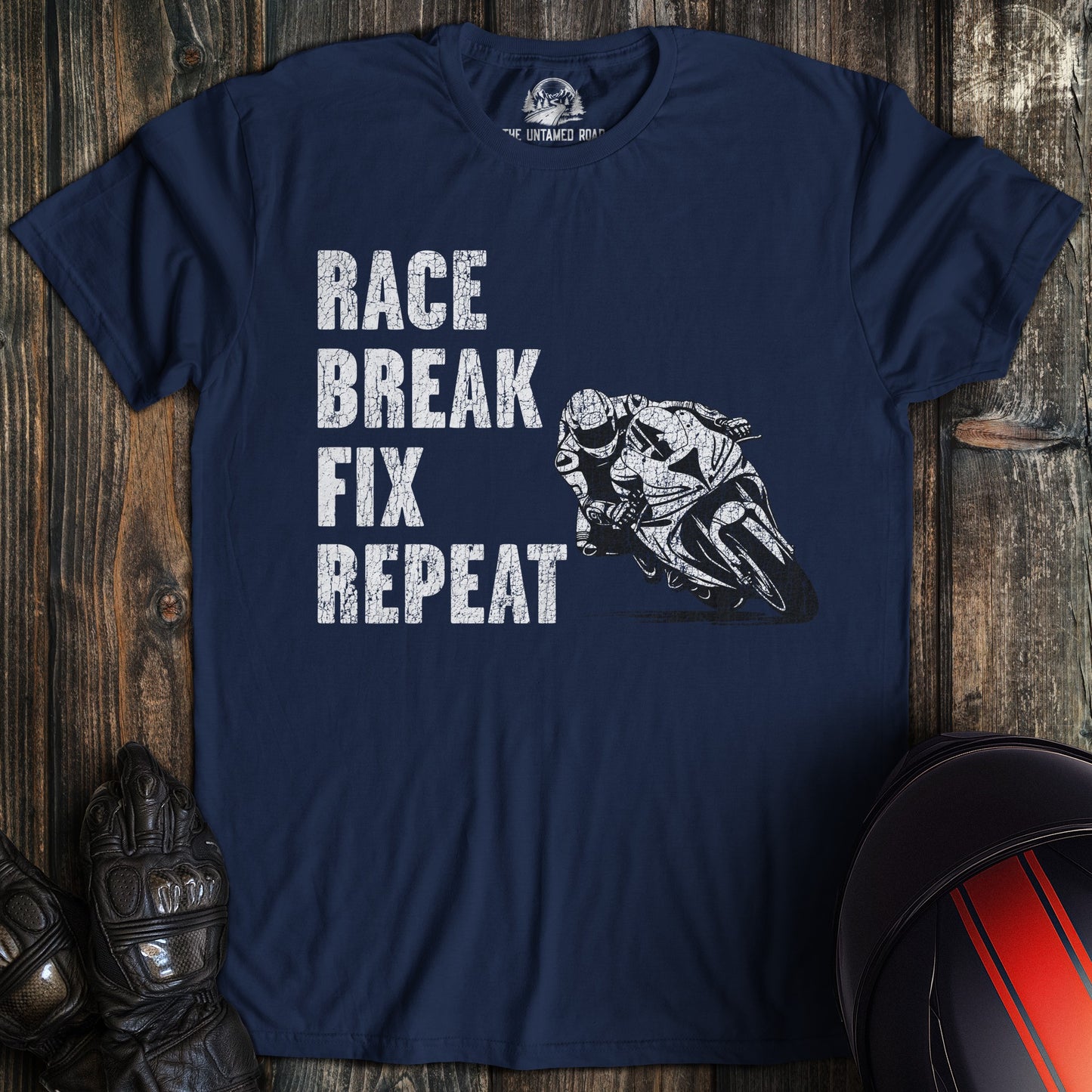 A navy colored t-shirt with the words "race break fix" printed on the front.