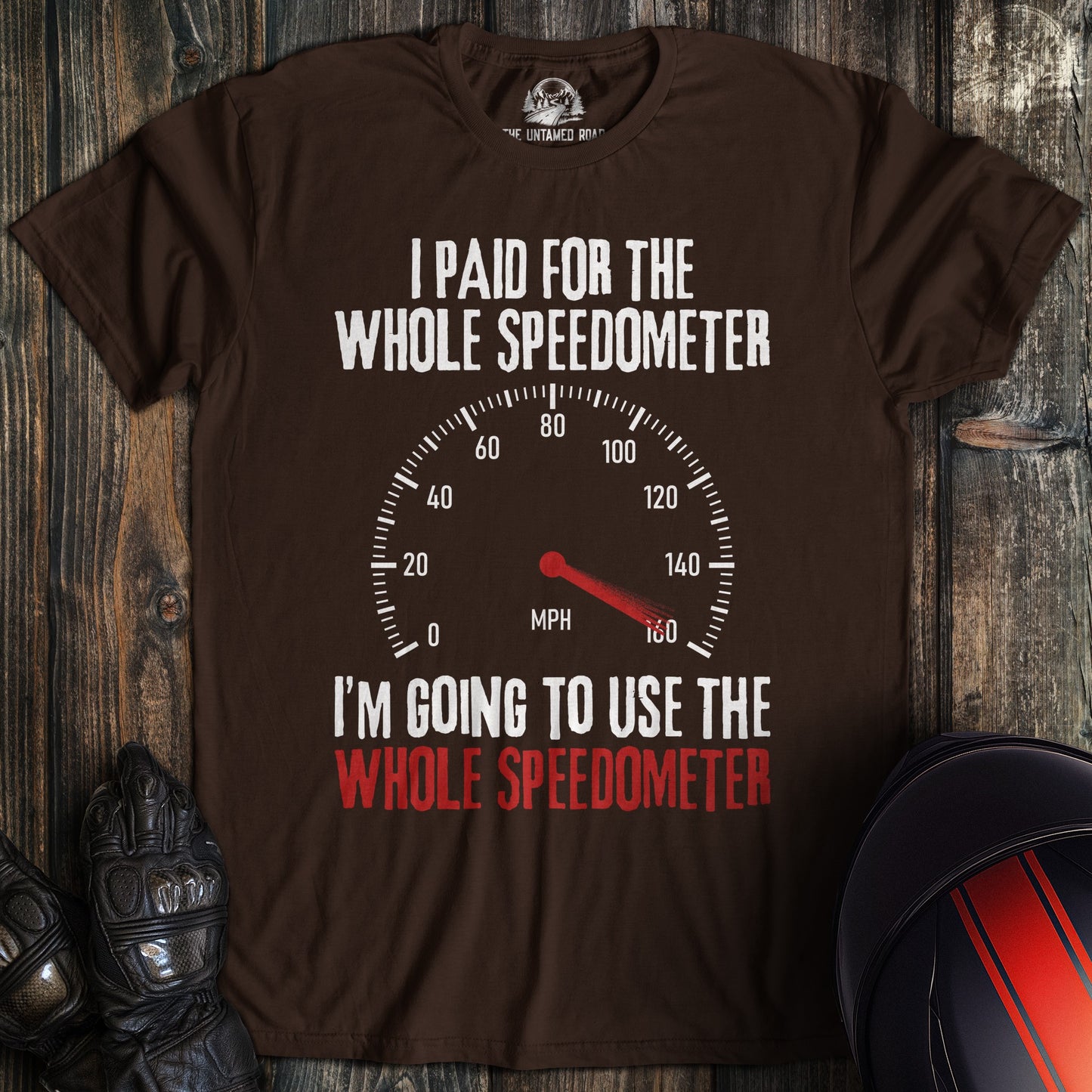 A dark brown t-shirt featuring a speedometer graphic and the funny biker quote, I Paid For The Whole Speedometer.