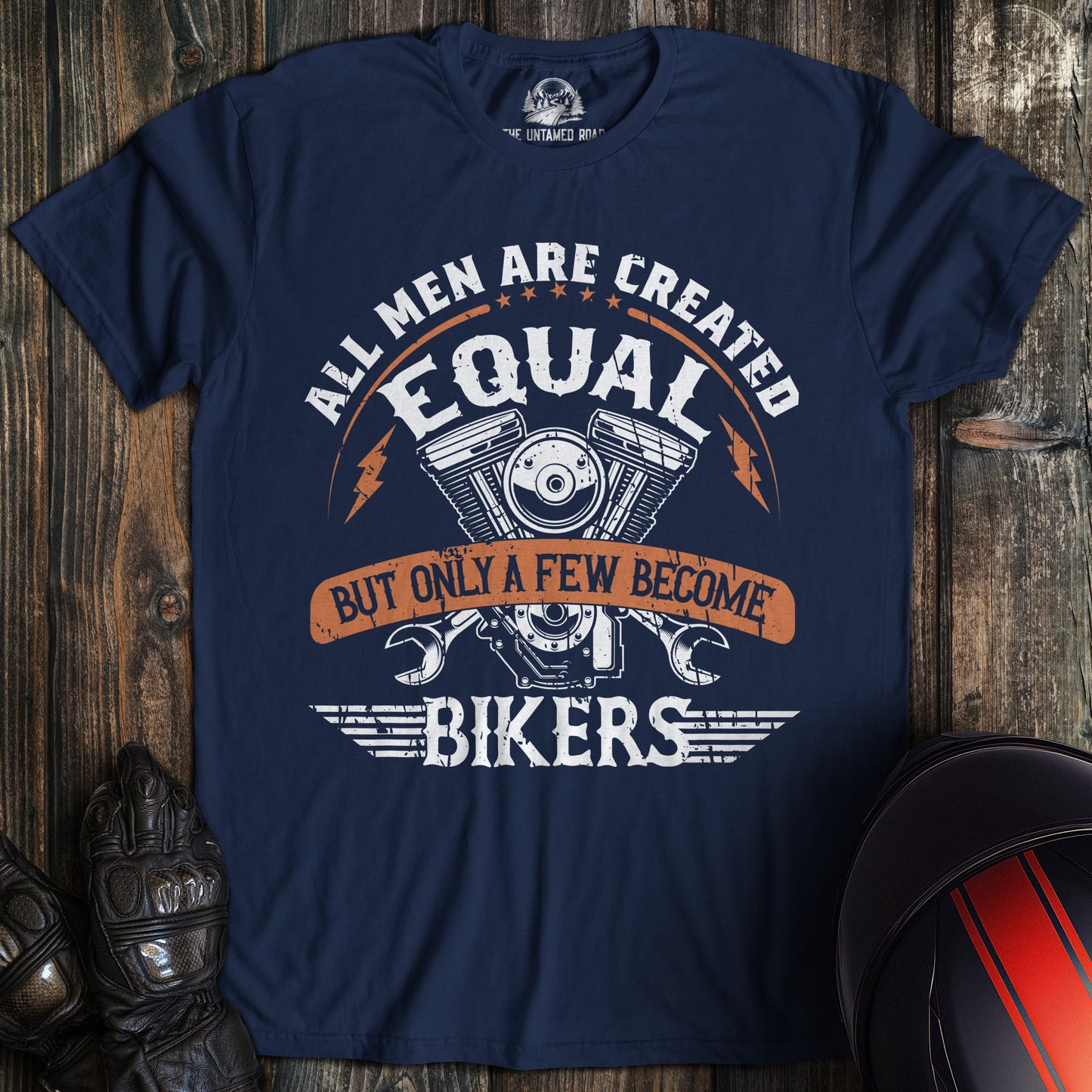 A navy colored t-shirt with the words "men created equal" printed on the front.
