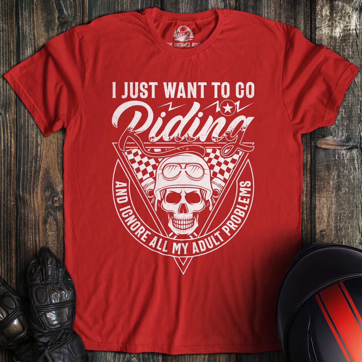 A red colored t-shirt with the words "ignore adult problems" printed on the front.