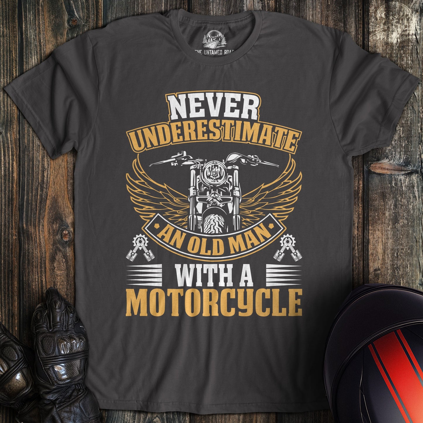 A charcoal colored t-shirt with the words "old man motorcycle" printed on the front.