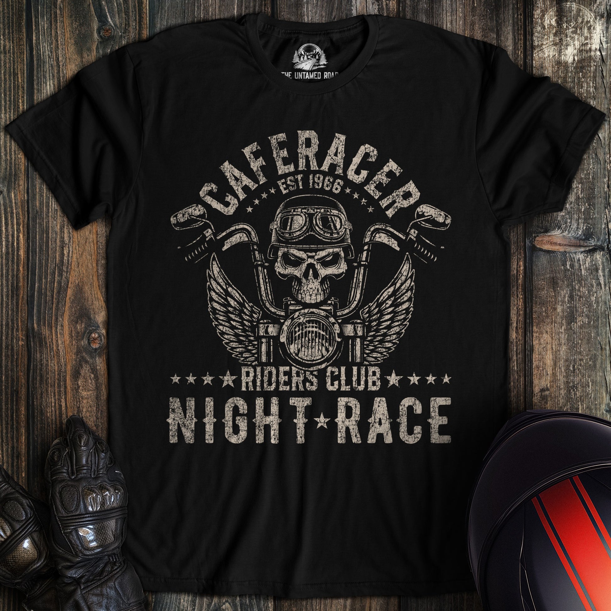A black t-shirt featuring a skull in a motorcycle helmet, wings, and the text Cafe Racer Riders Club Night Race.