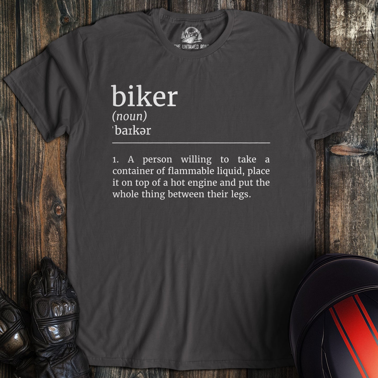 A charcoal colored t-shirt with the words "biker definition" printed on the front.