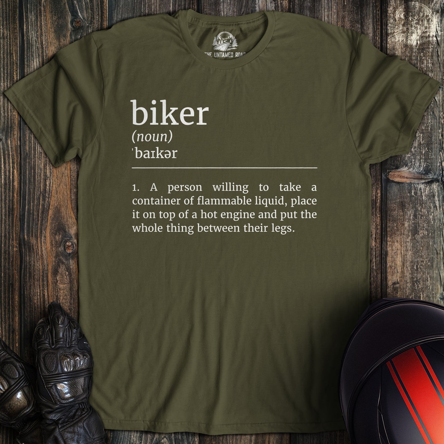 A military green colored t-shirt with the words "biker definition" printed on the front.