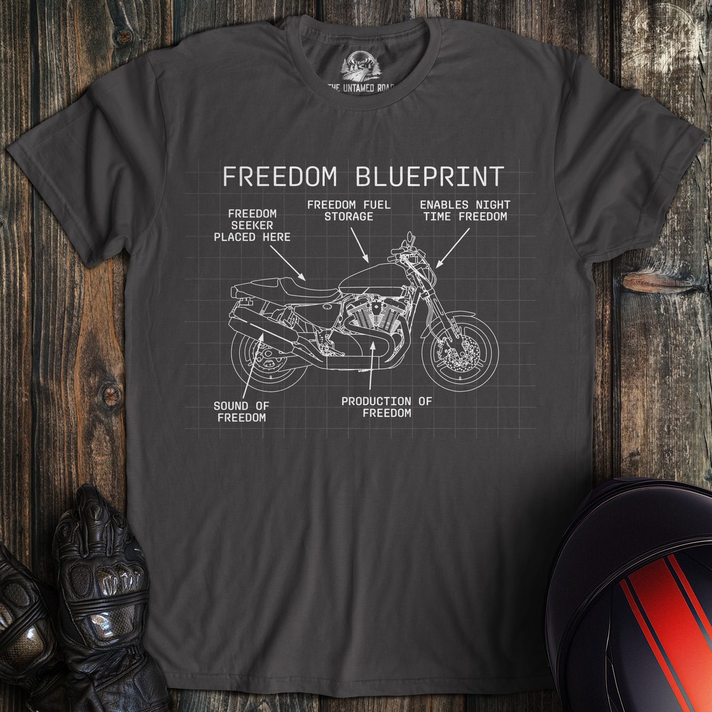 A charcoal colored t-shirt with the words "freedom blueprint" printed on the front.