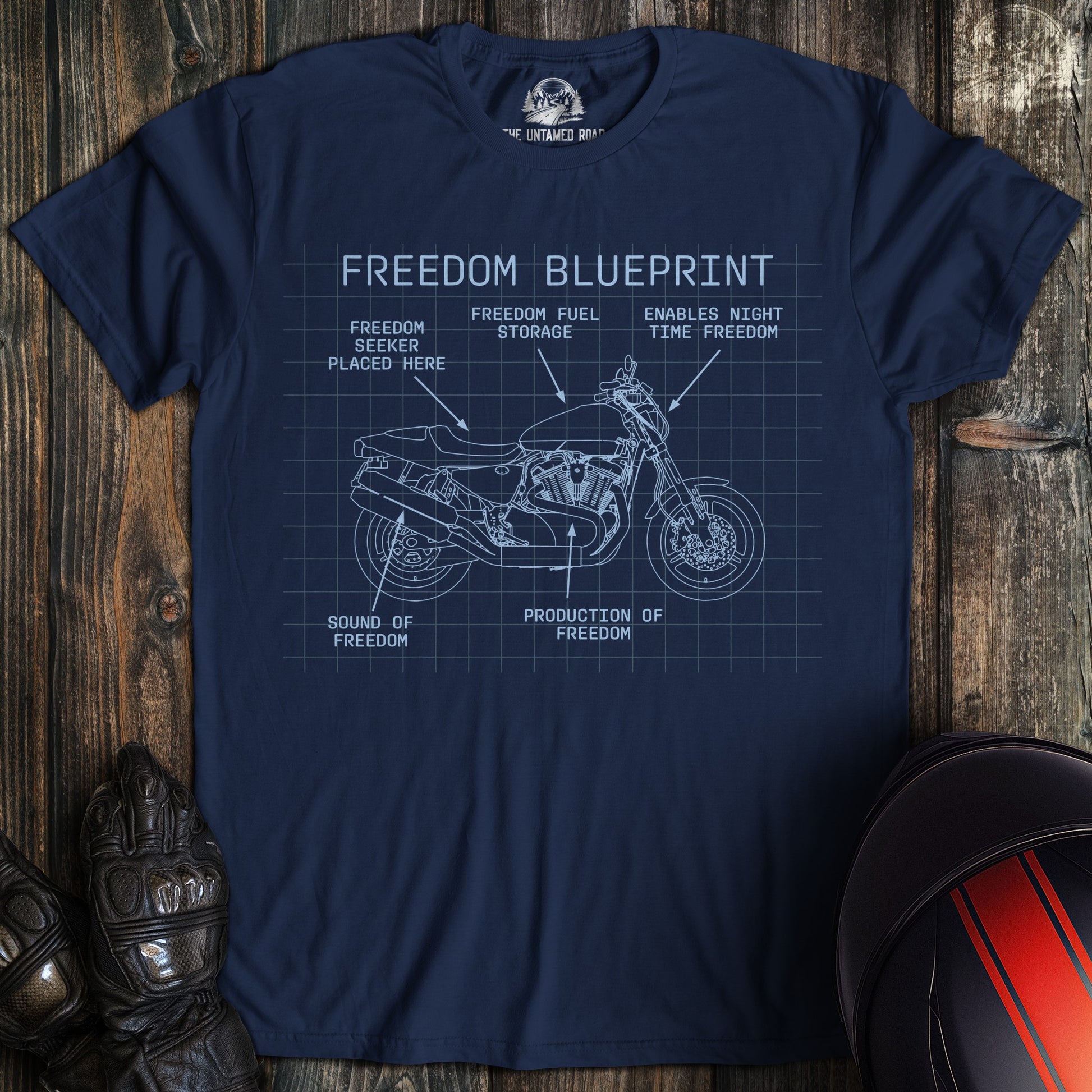 A navy colored t-shirt with the words "freedom blueprint" printed on the front.