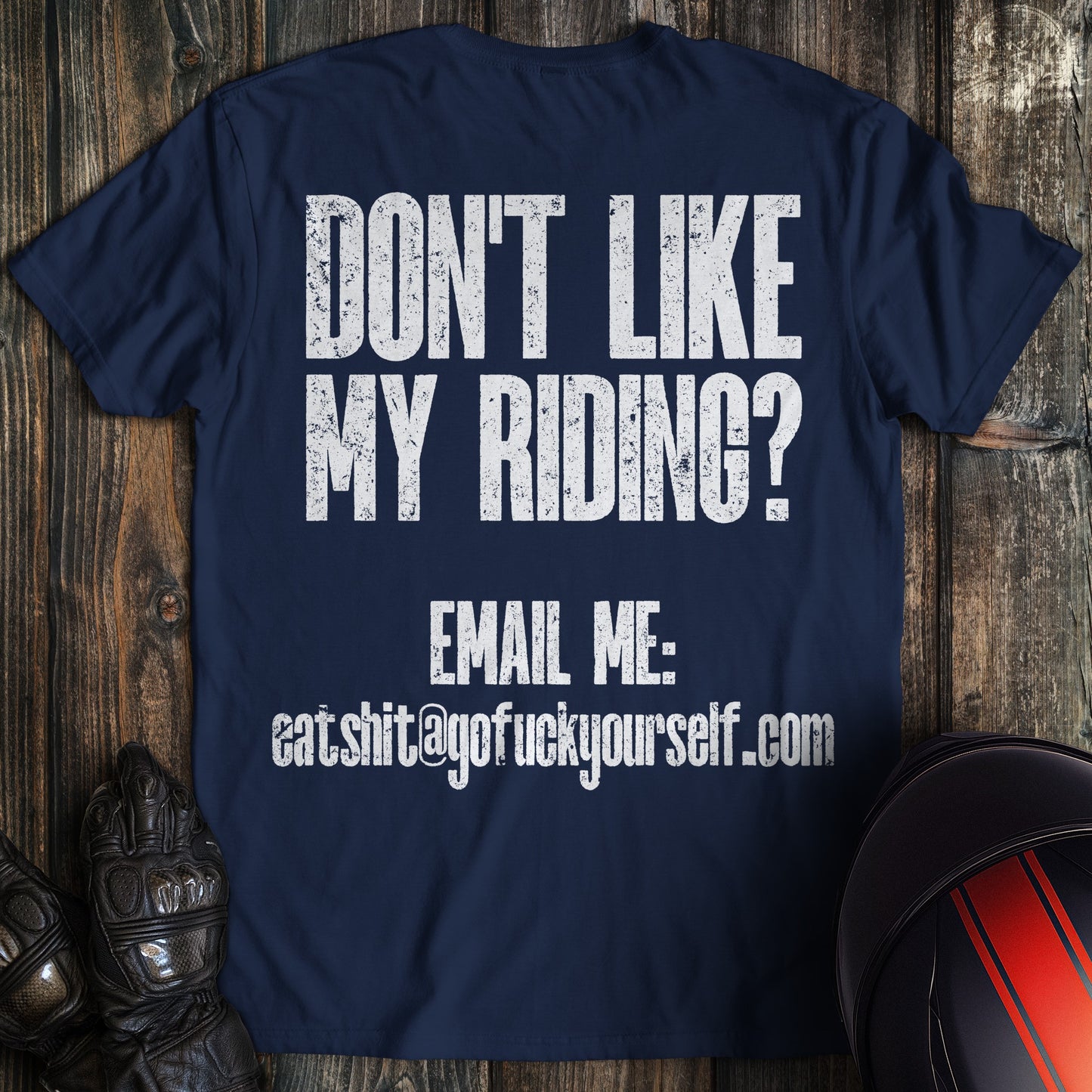 A navy colored t-shirt with the words "dont like riding email" printed on the back.