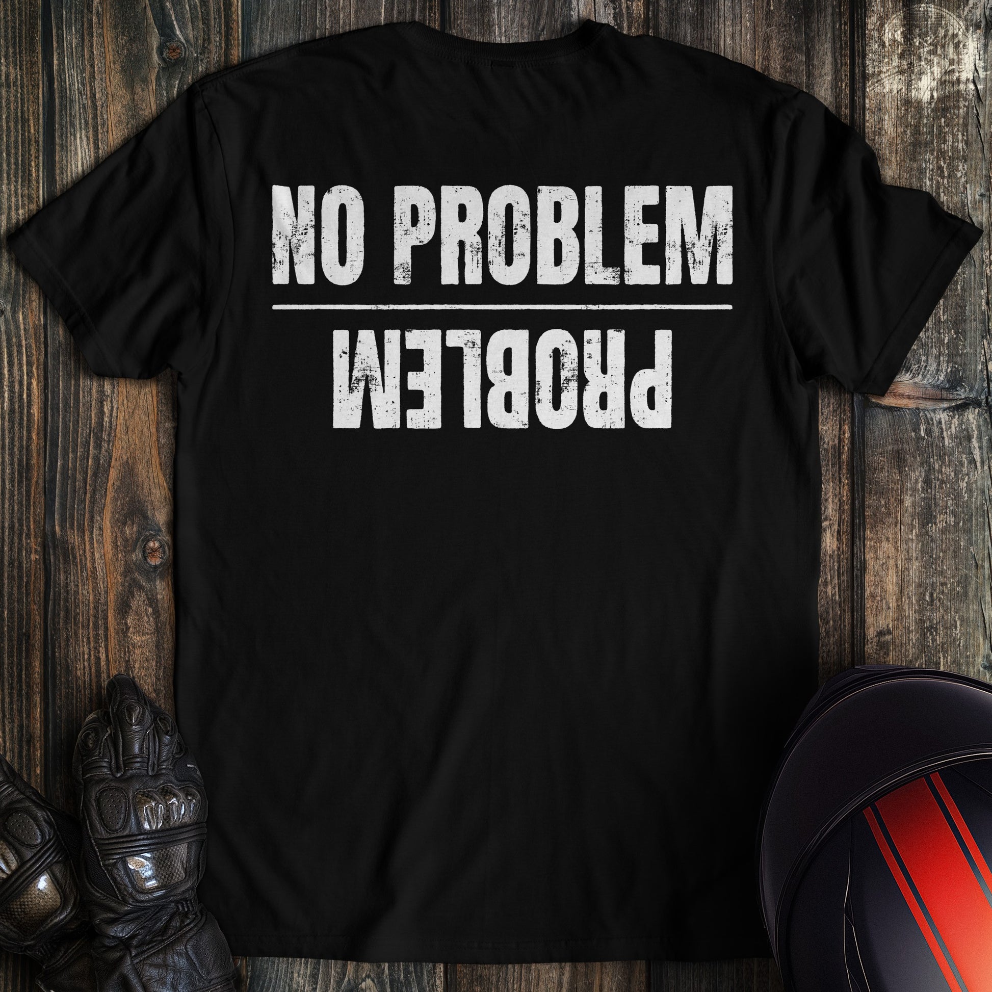 A black colored t-shirt with the words "no problem problem" printed on the back.