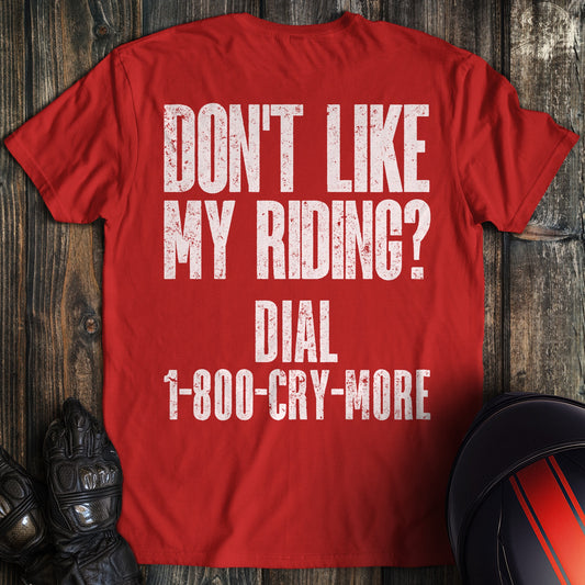 A red colored t-shirt with the words "riding complaint clean" printed on the back.