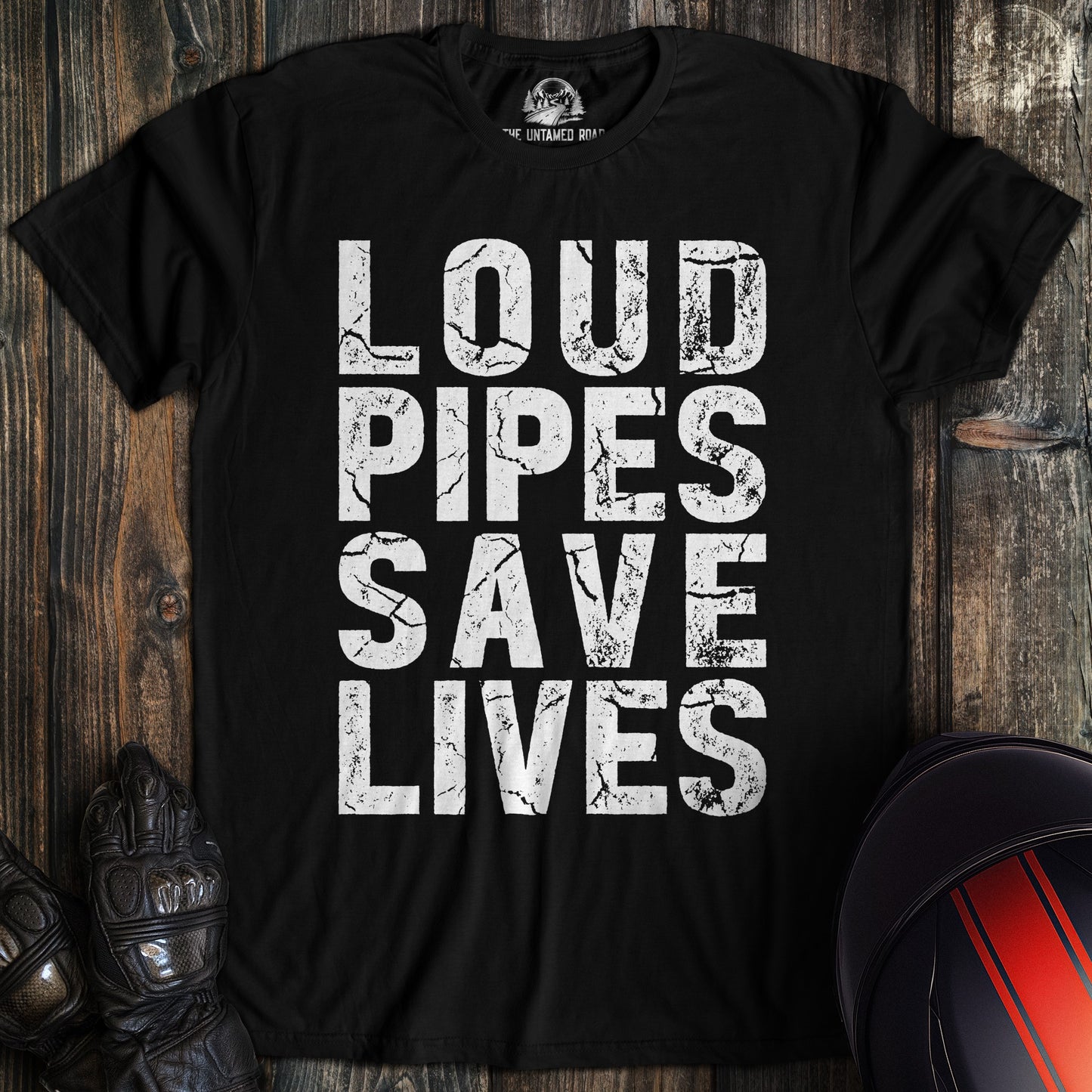A black biker t-shirt featuring the phrase Loud Pipes Save Lives in a white, distressed block font.