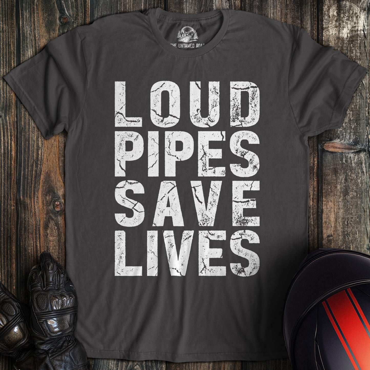 A charcoal gray biker t-shirt featuring the words LOUD PIPES SAVE LIVES in a white, distressed block font.