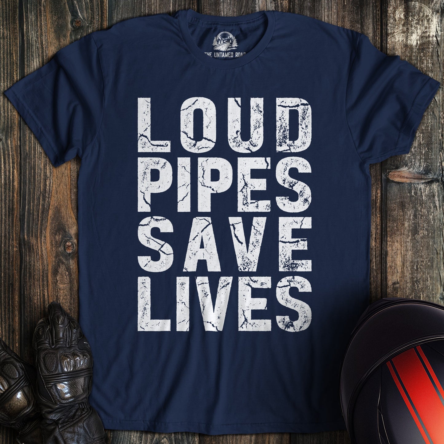 A navy blue biker t-shirt featuring the phrase Loud Pipes Save Lives in a white, distressed block font.