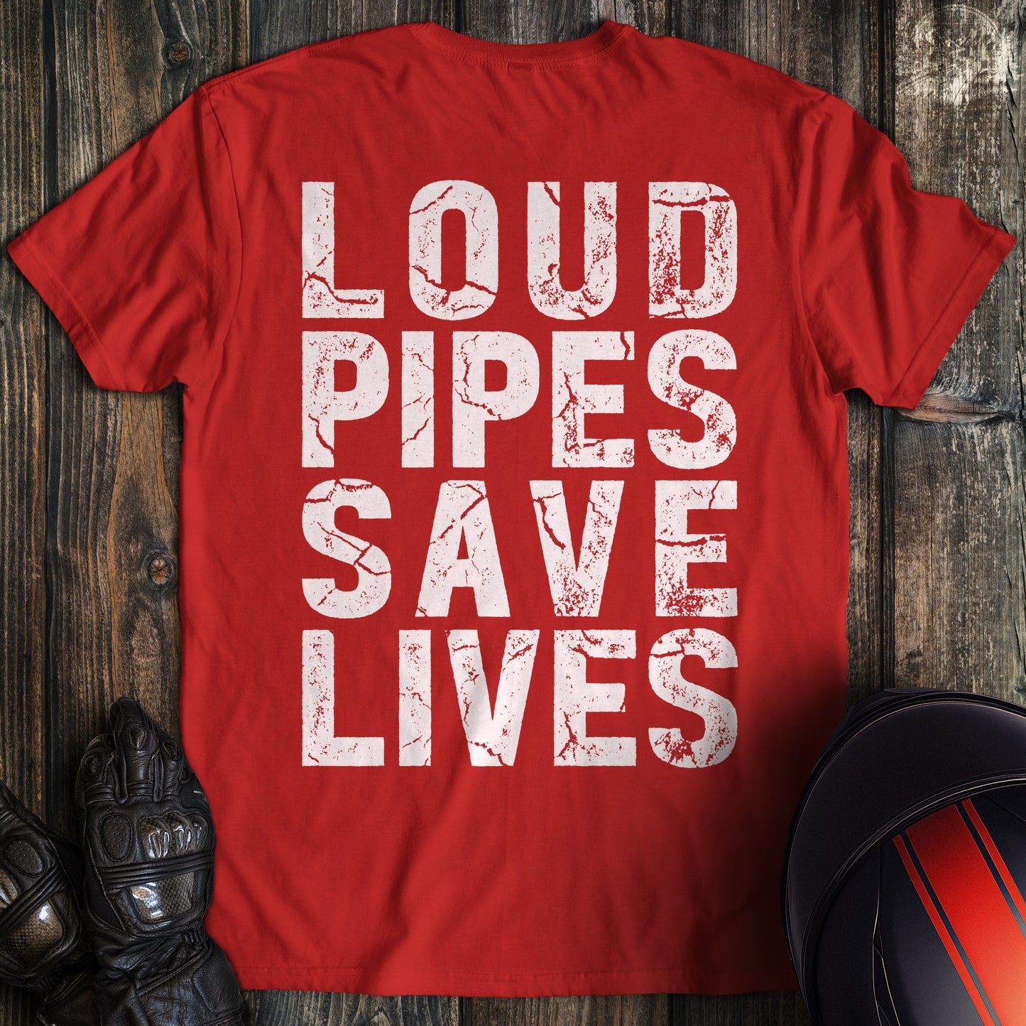 A red t-shirt featuring the words LOUD PIPES SAVE LIVES in a white, distressed block font.