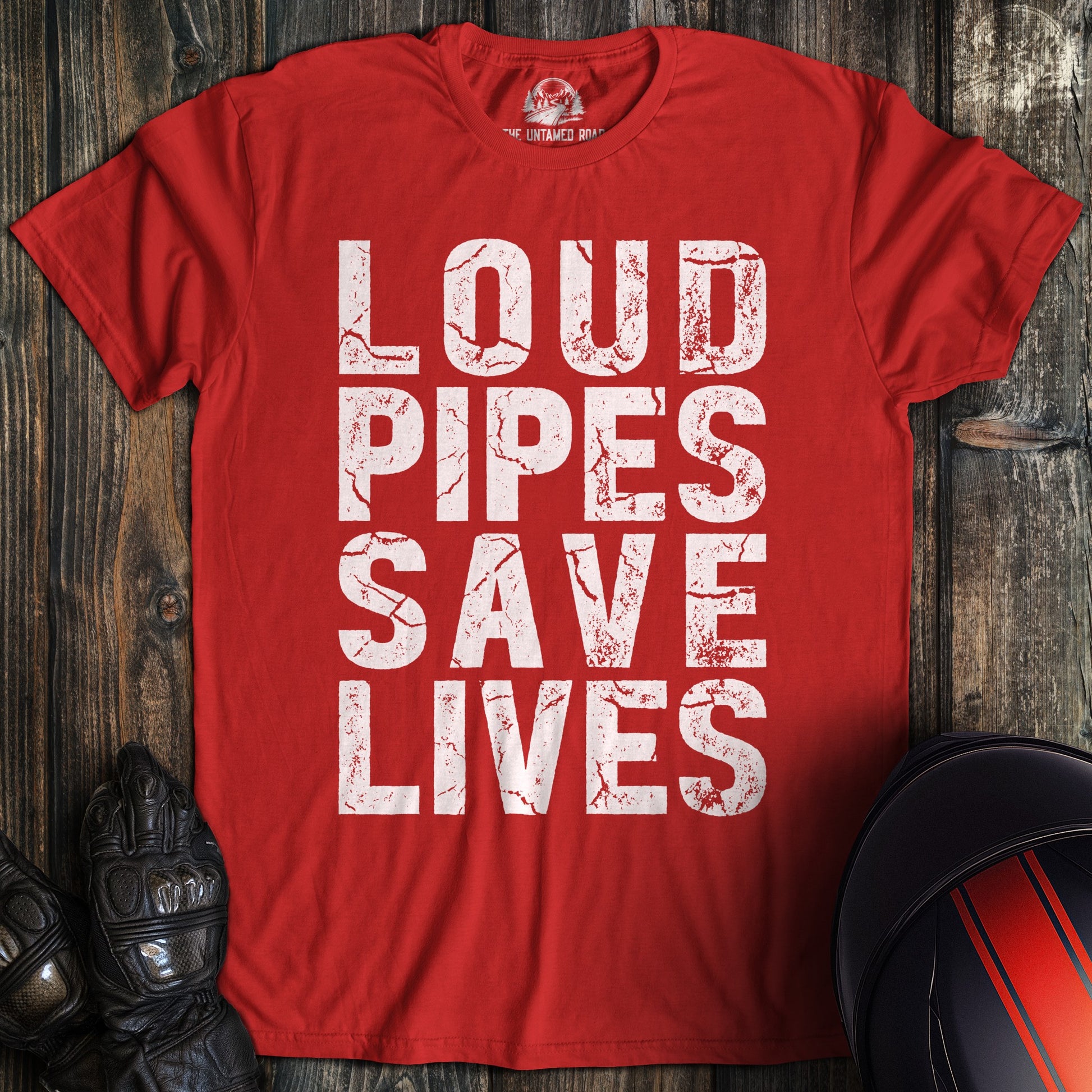 A red t-shirt featuring the words LOUD PIPES SAVE LIVES in a white, distressed block font.