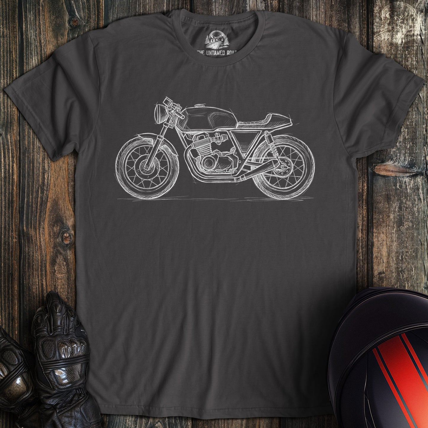 A charcoal colored t-shirt with the words "cafe racer sketch" printed on the front.