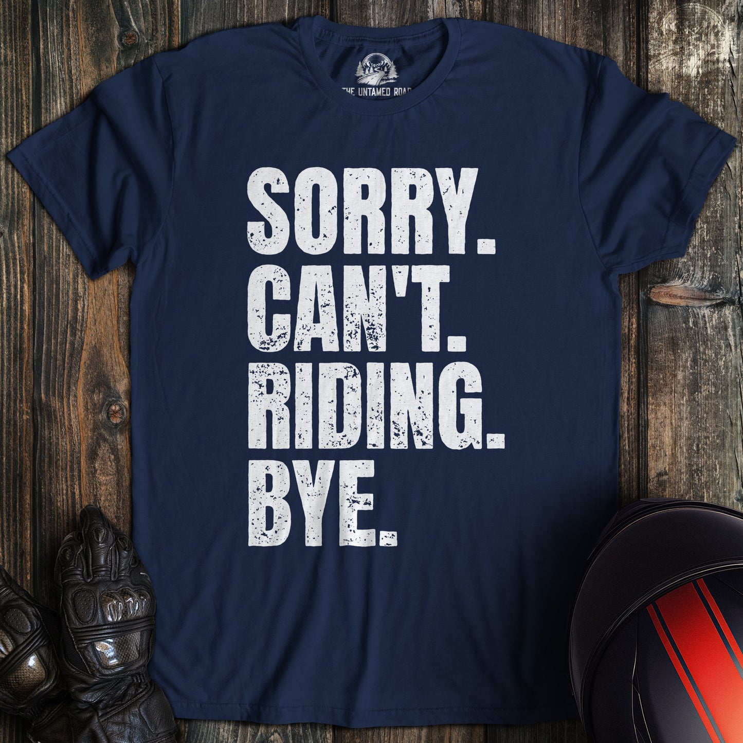 A navy blue t-shirt with white distressed text that reads SORRY. CAN'T. RIDING. BYE. for a motorcycle biker.