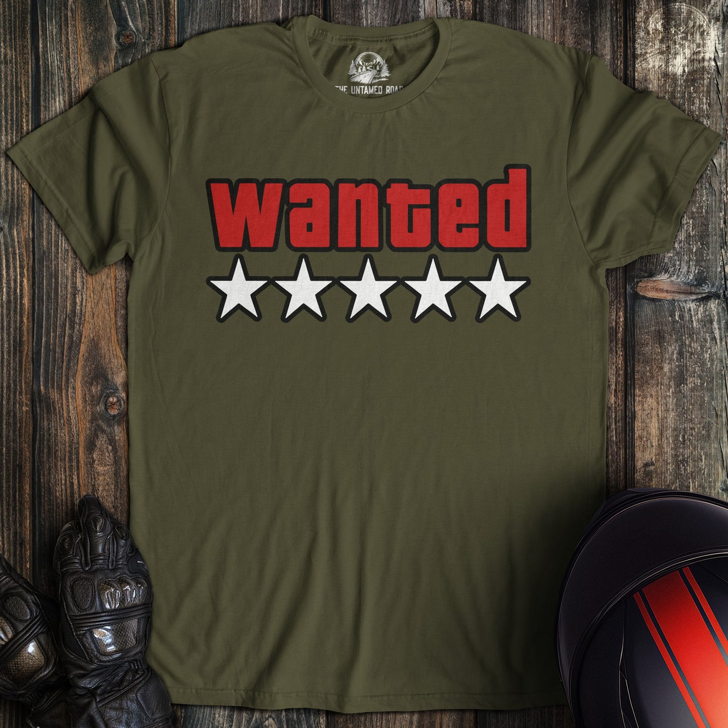 A military green t-shirt featuring the word 'wanted' in red block letters above five white stars.