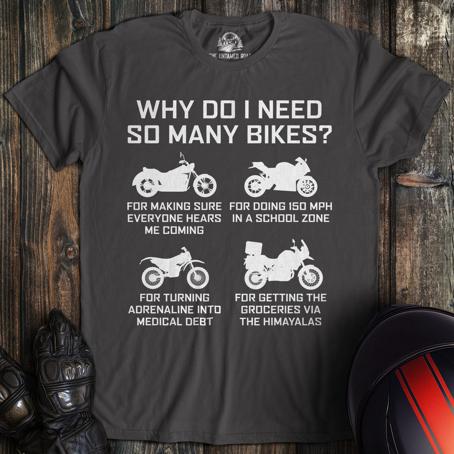 A charcoal gray t-shirt featuring four motorcycle silhouettes and funny text about why a biker needs so many bikes.