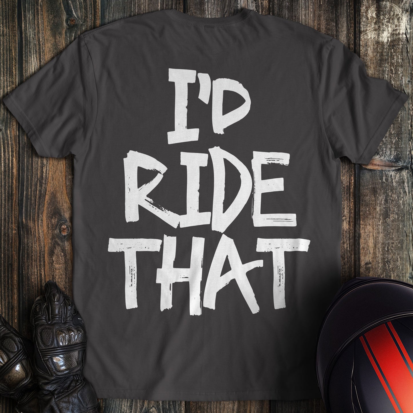 A charcoal gray biker t-shirt featuring the words I'D RIDE THAT in a white, distressed paint-stroke font.