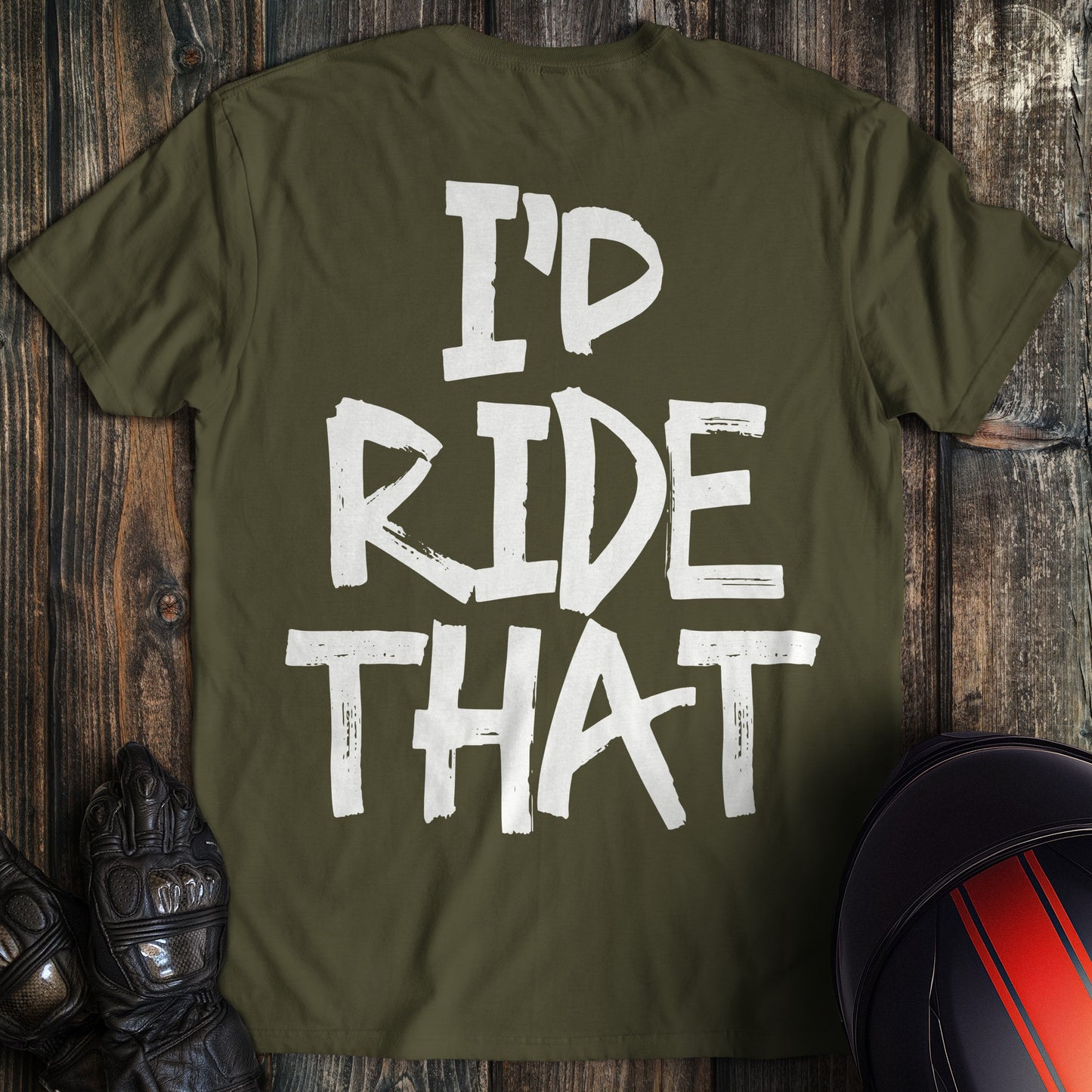 A military green biker t-shirt featuring the phrase I'd Ride That in a white, distressed paint-style font.
