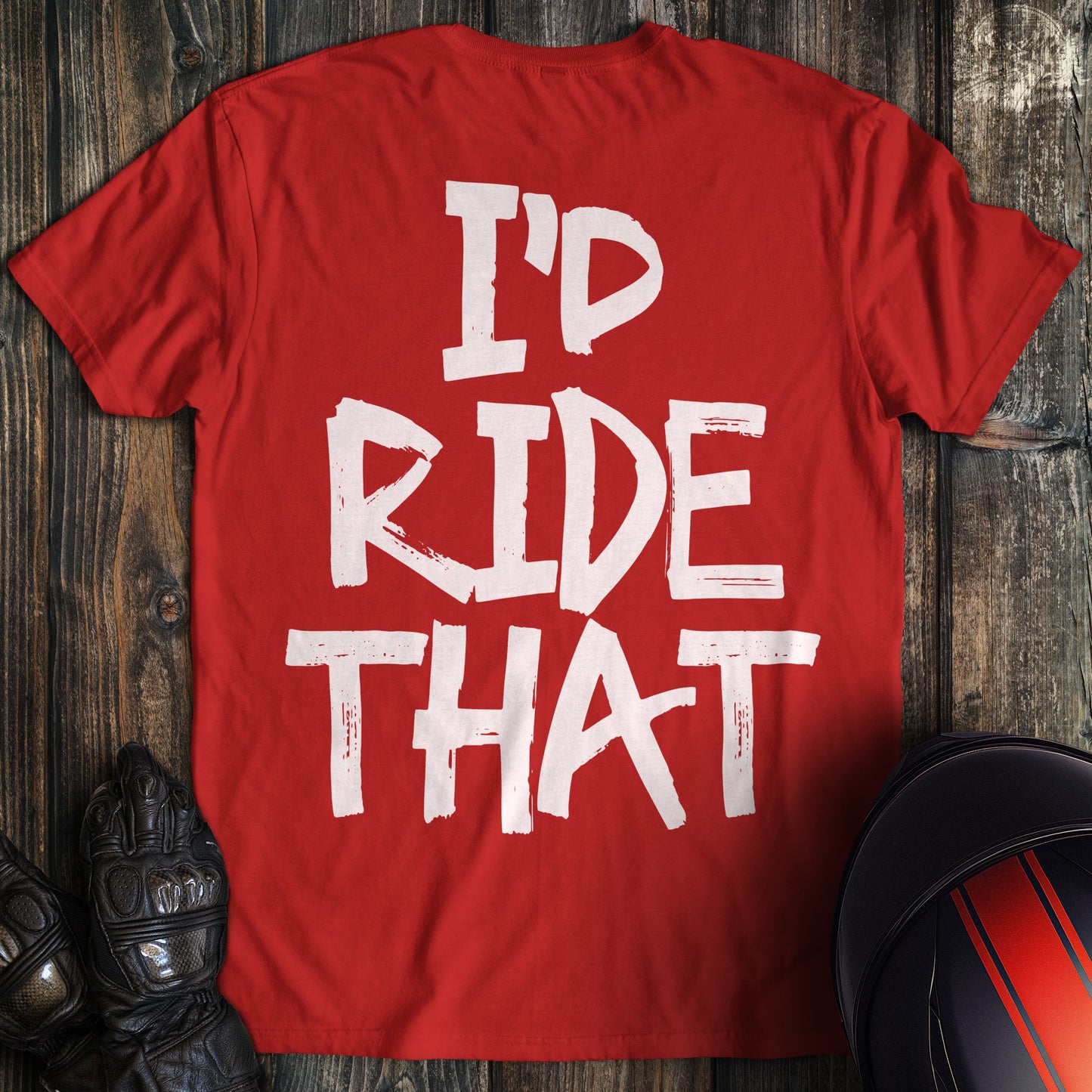 A red t-shirt featuring the phrase "I'D RIDE THAT" in a white, distressed paint-style font.