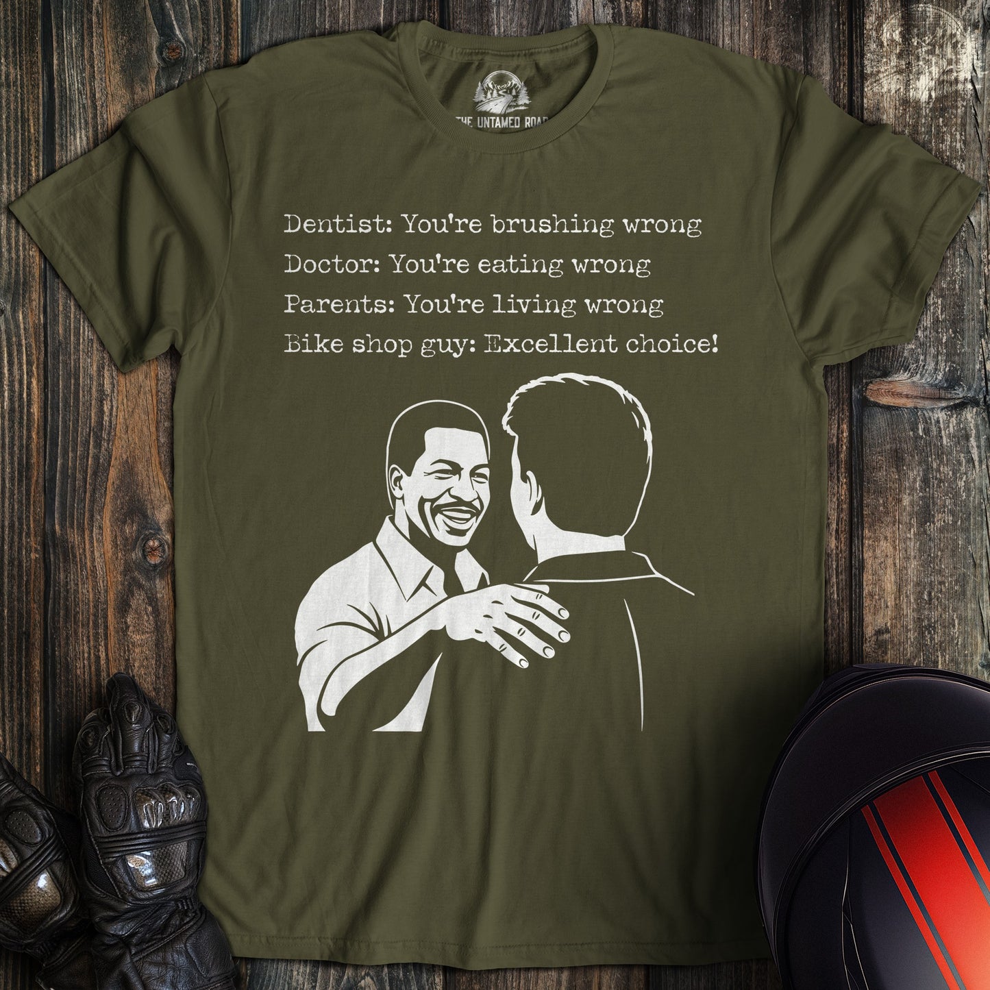 A military green t-shirt featuring a funny biker graphic and text about a bike shop guy saying, "Excellent choice!"
