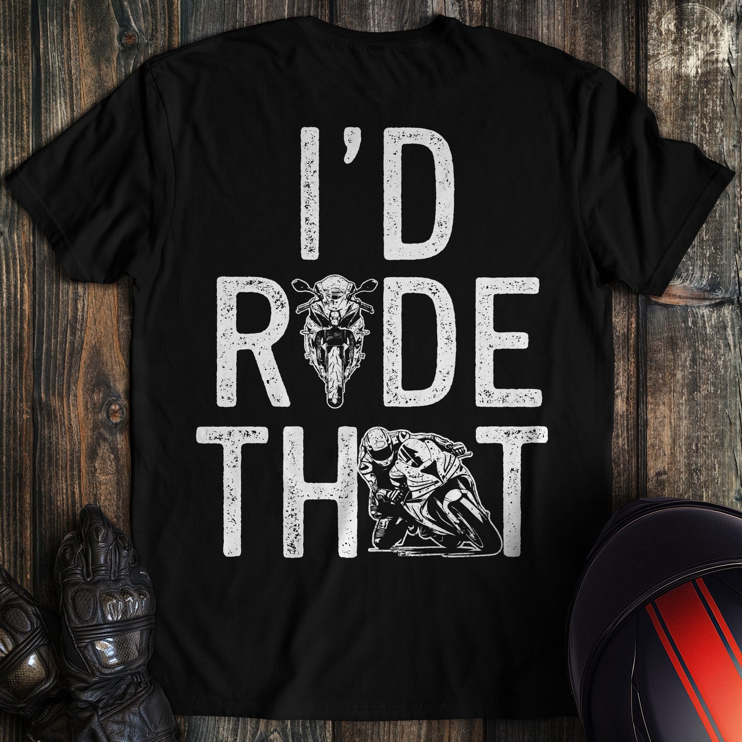 A black t-shirt featuring the text I'd Ride That in a distressed white font with motorcycle and biker graphics.