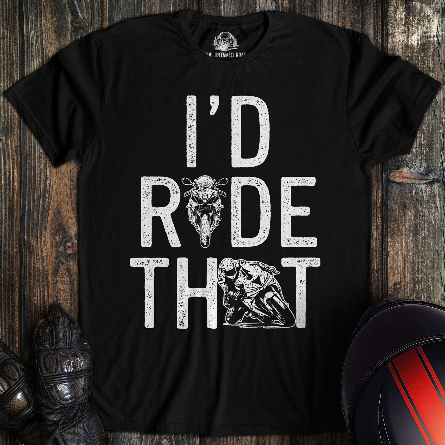 A black t-shirt featuring the text I'd Ride That in white distressed font with motorcycle and biker graphics.