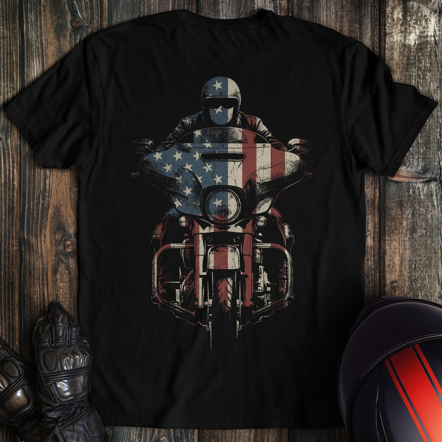 A black crew neck t-shirt featuring a graphic of a biker on a motorcycle with an American flag overlay.