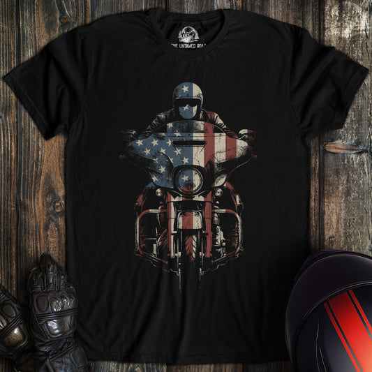 A black crew neck t-shirt featuring a graphic of a biker on a motorcycle with an American flag pattern overlay.
