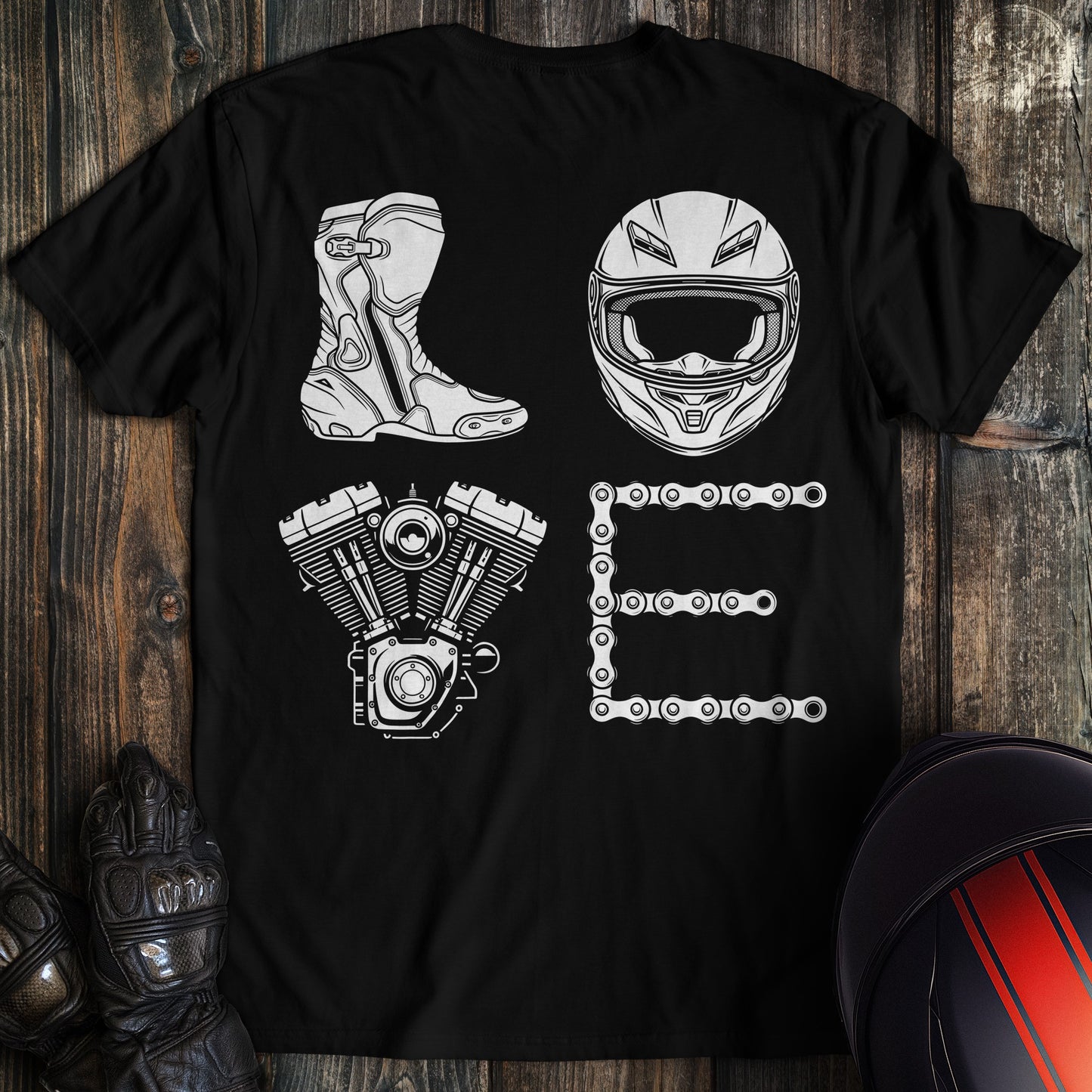 Black t-shirt with white motorcycle gear graphics spelling LOVE using a boot, helmet, engine, and chain.