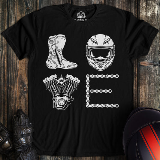 A black t-shirt featuring the word LOVE spelled with a biker boot, motorcycle helmet, engine, and drive chain.