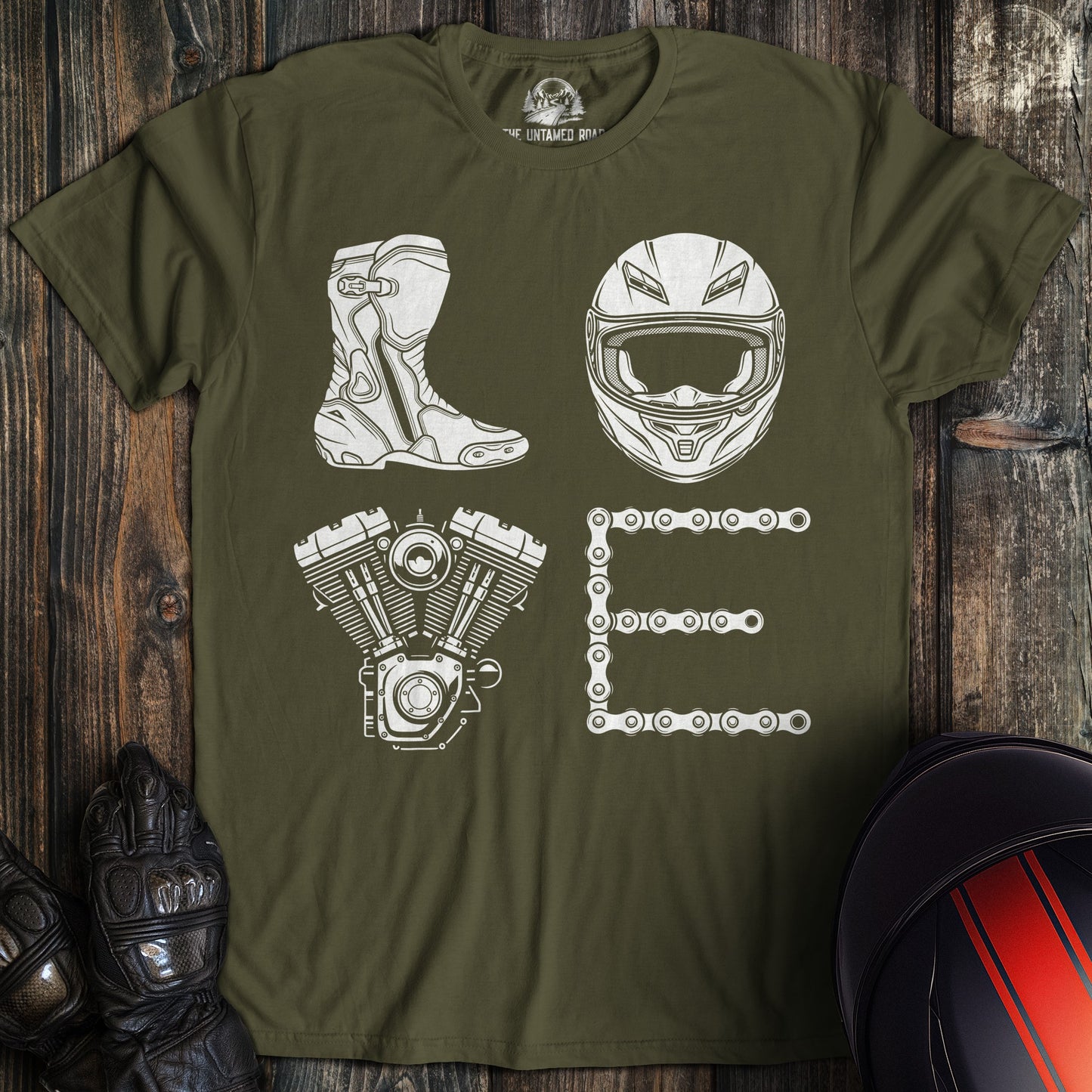 A military green t-shirt featuring the word LOVE spelled with a motorcycle boot, helmet, engine, and chain.